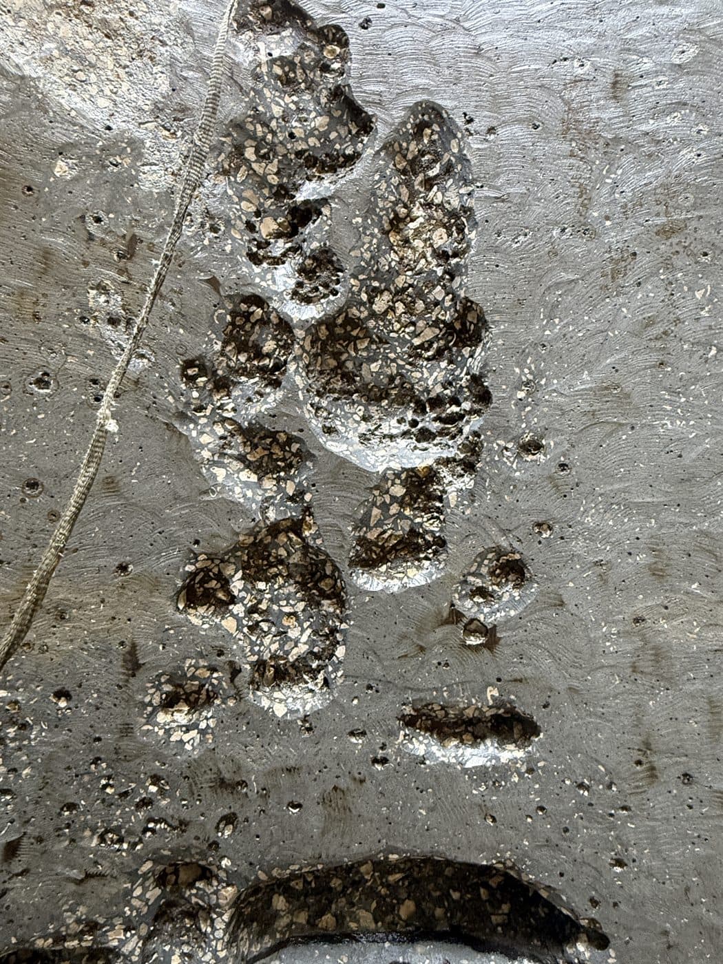 Deteriorated concrete removed to sound substrate