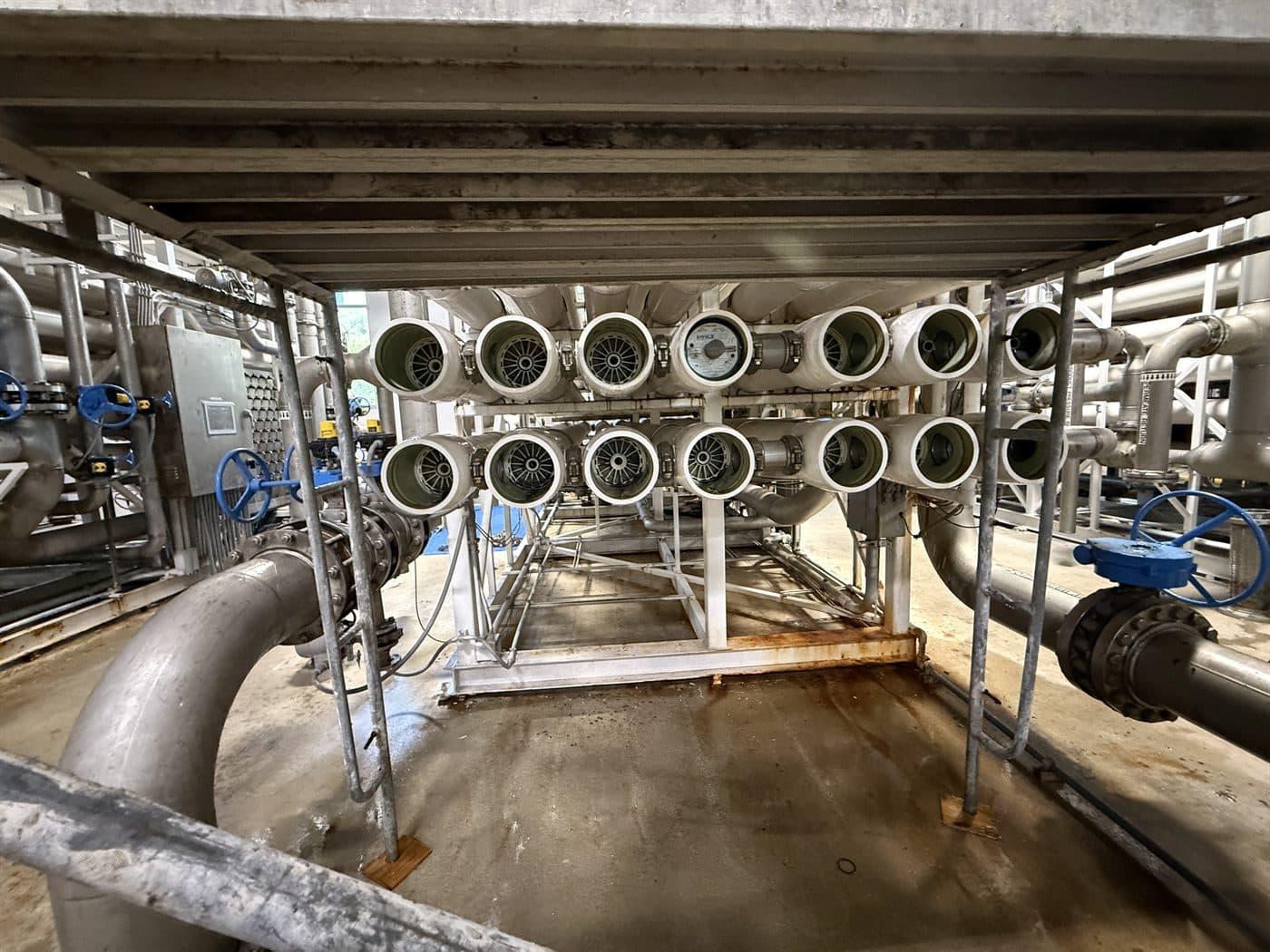 Rows of reverse osmosis membrane pressure vessels at a treatment facility